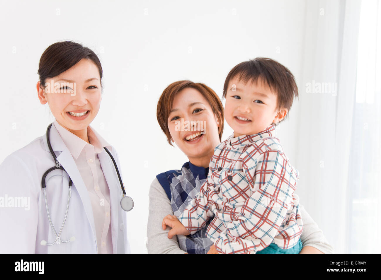 Mother and son with doctor Stock Photo - Alamy