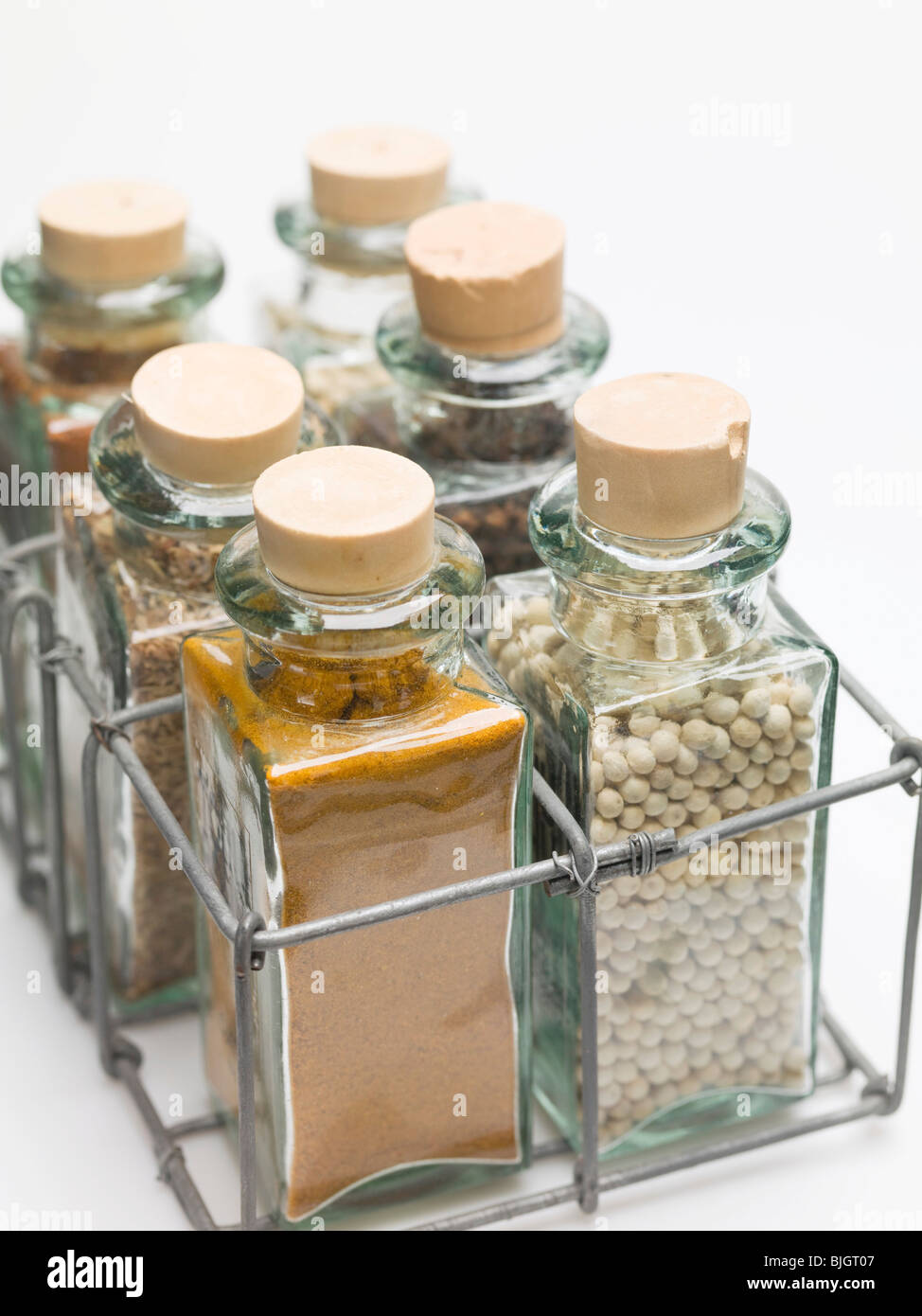Various spices in small glass bottles Stock Photo Alamy