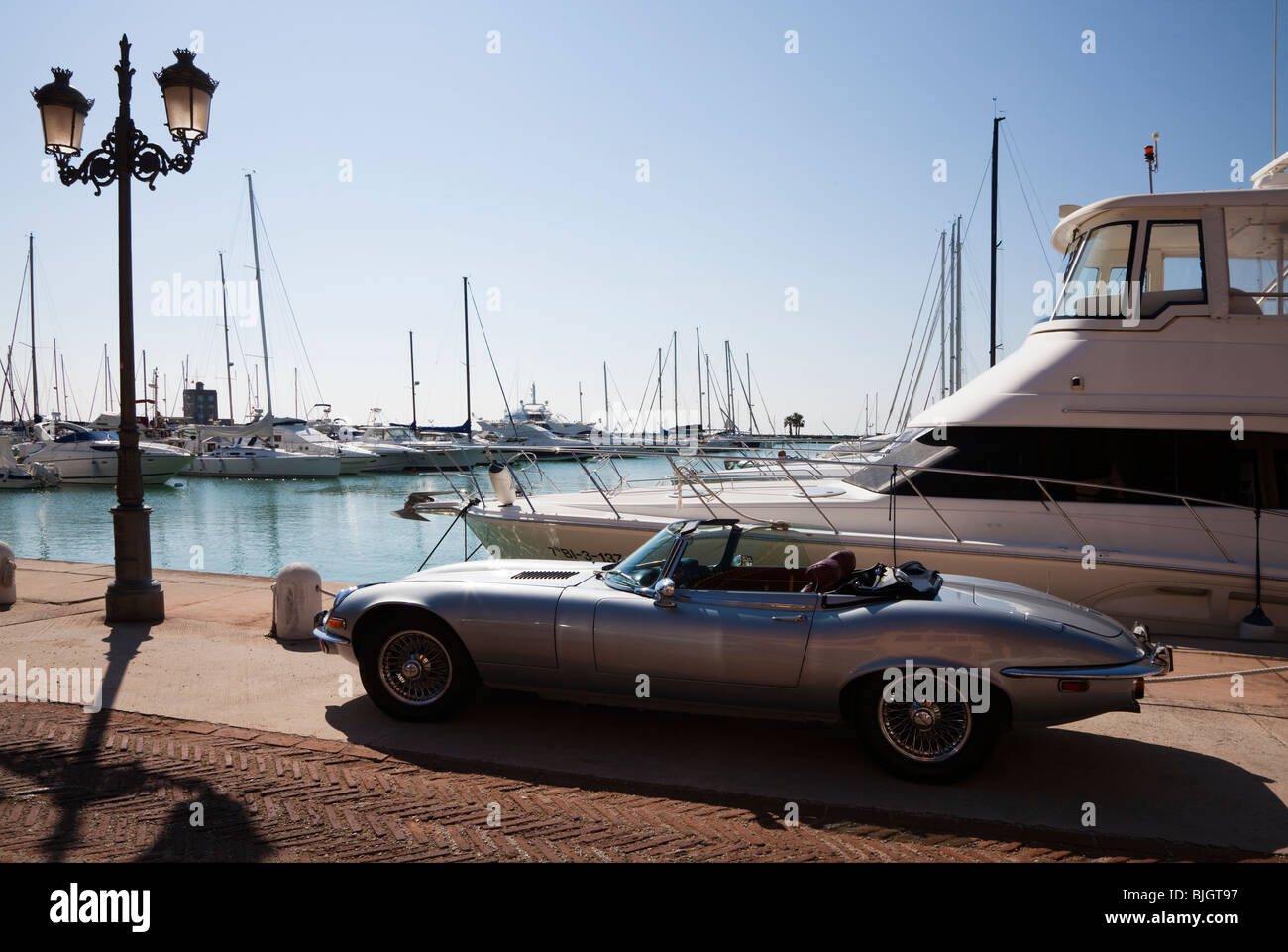 V12 Jaguar e type parked on the marina at Sotogrande, Spain Stock Photo