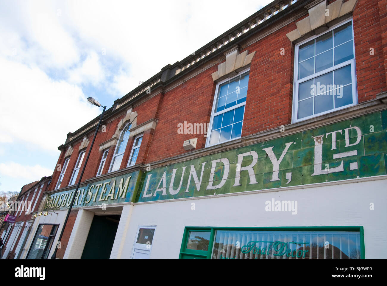 Old shop front sign of Salisbury Steam laundry in Winchester St Stock Photo