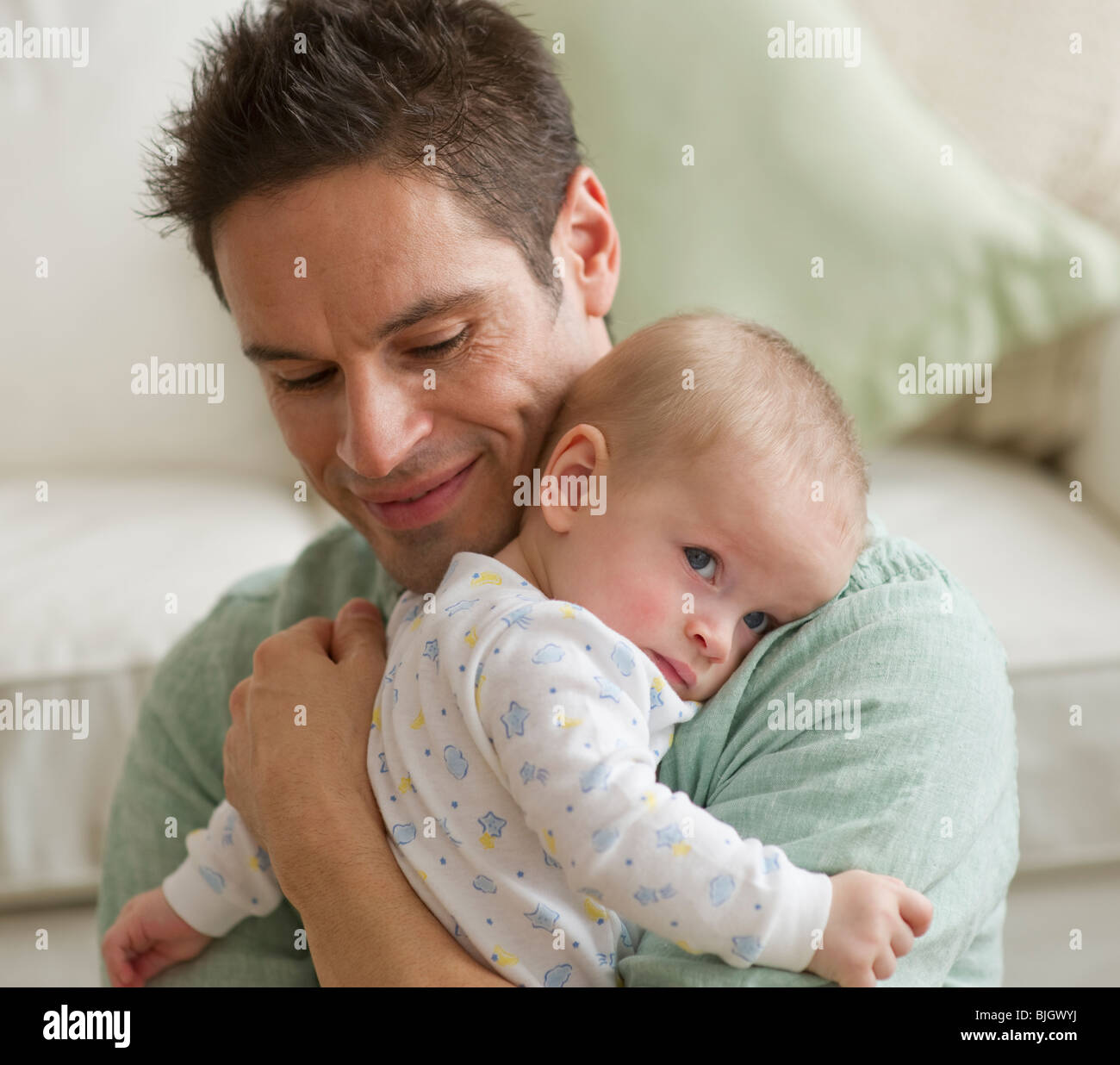Father hugging baby Stock Photo