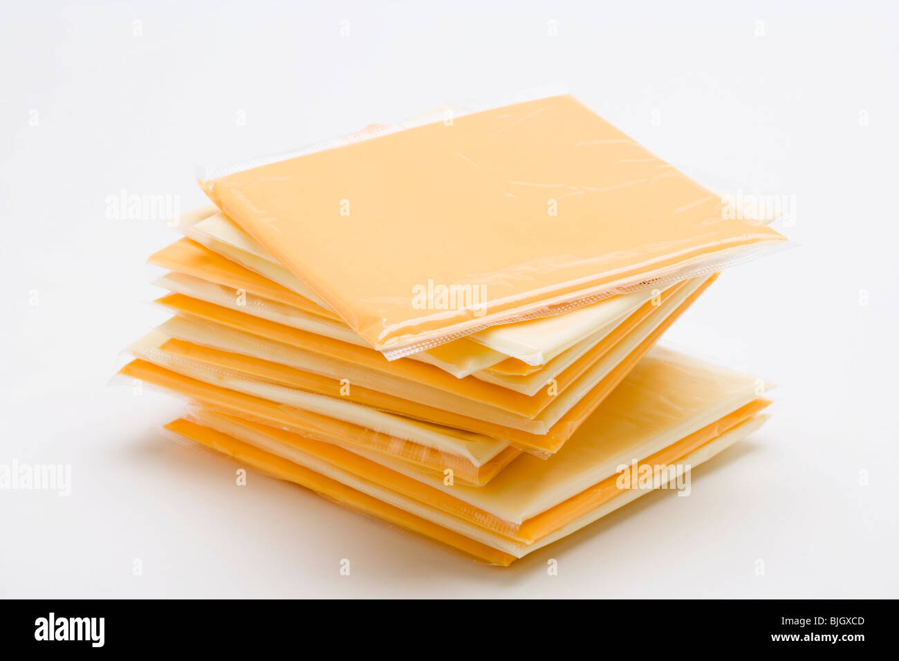 Cheese slices individually wrapped in plastic - Stock Photo
