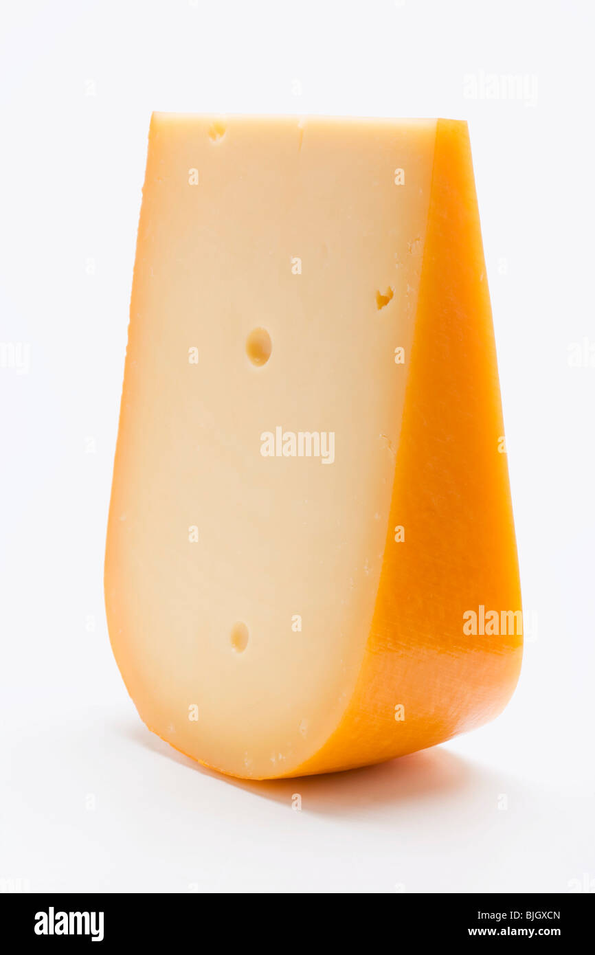 A piece of Gouda cheese Stock Photo Alamy