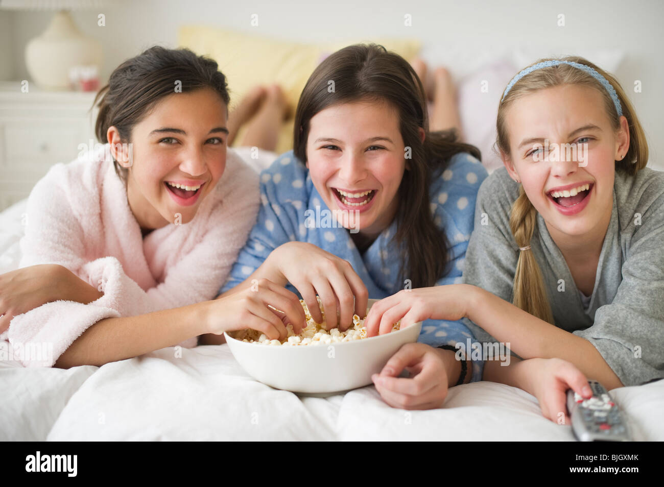 Girls eating popcorn Stock Photo