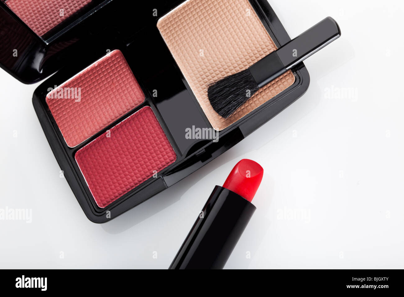 close-up of make up case with brush and red lipstick Stock Photo