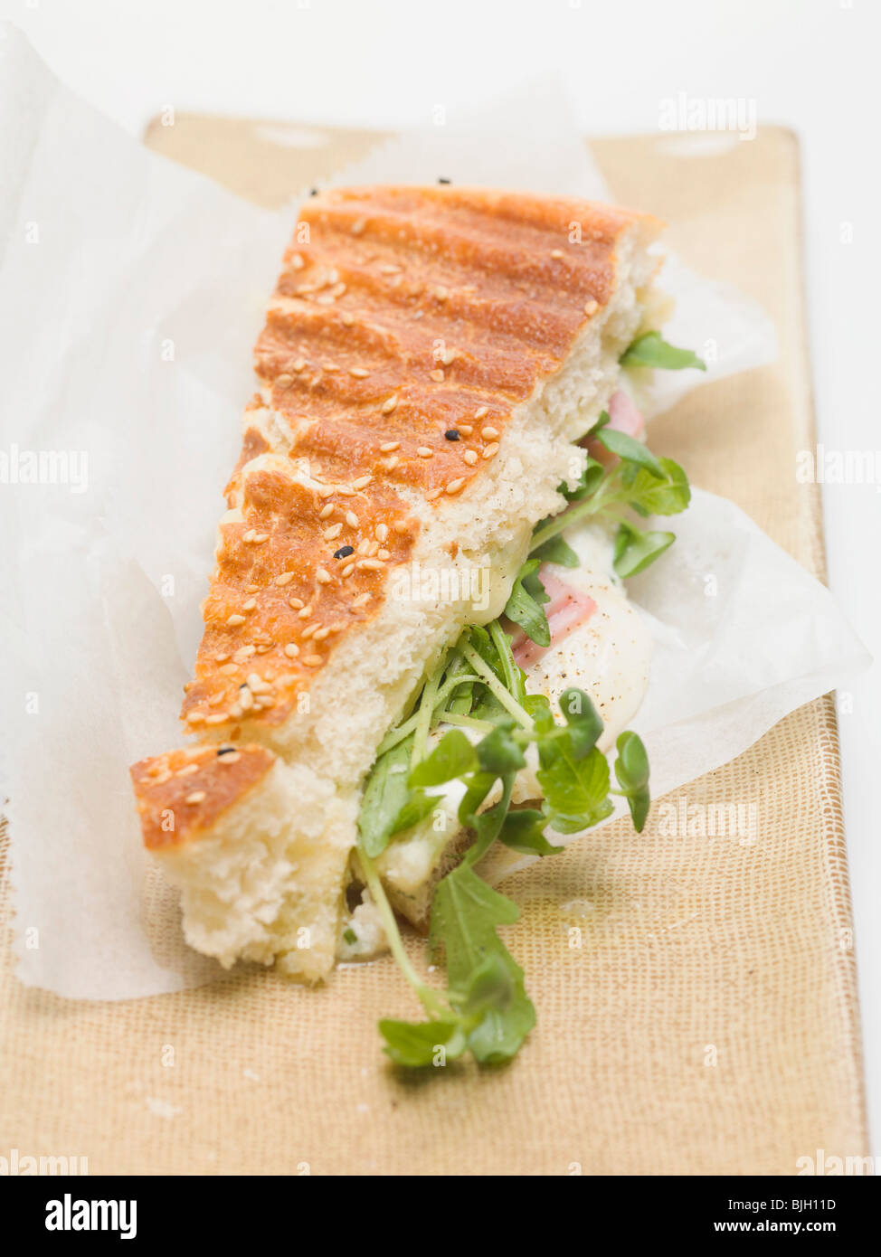 Flatbread filled with cheese, ham and rocket Stock Photo Alamy