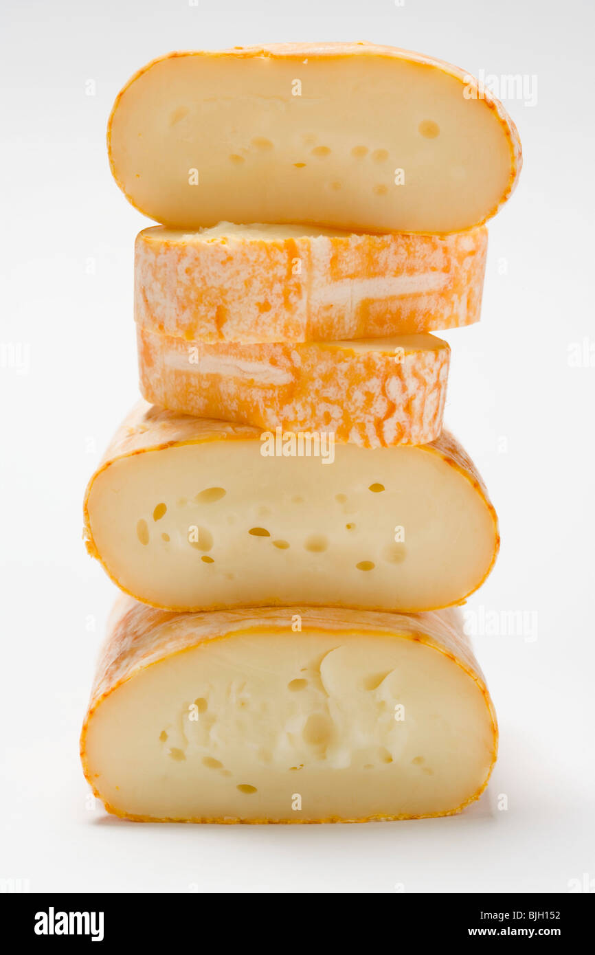 Cow's milk cheeses, stacked Stock Photo Alamy