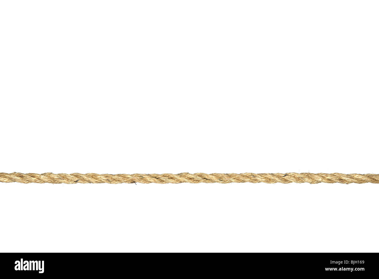 A straight line of twisted manila rope isolated on a white background. Stock Photo