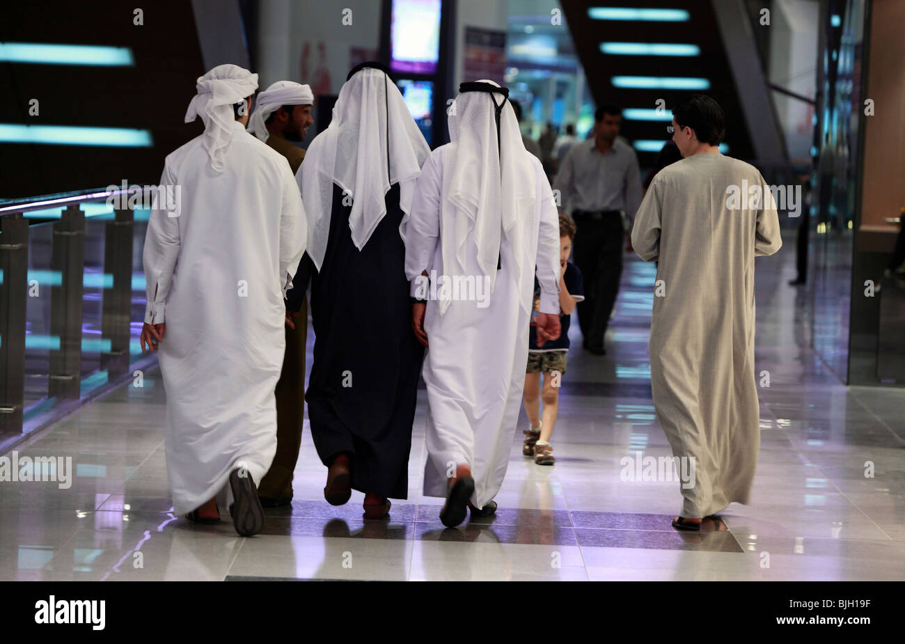 Arabs in the Mall of Dubai, United Arab Emirates Stock Photo