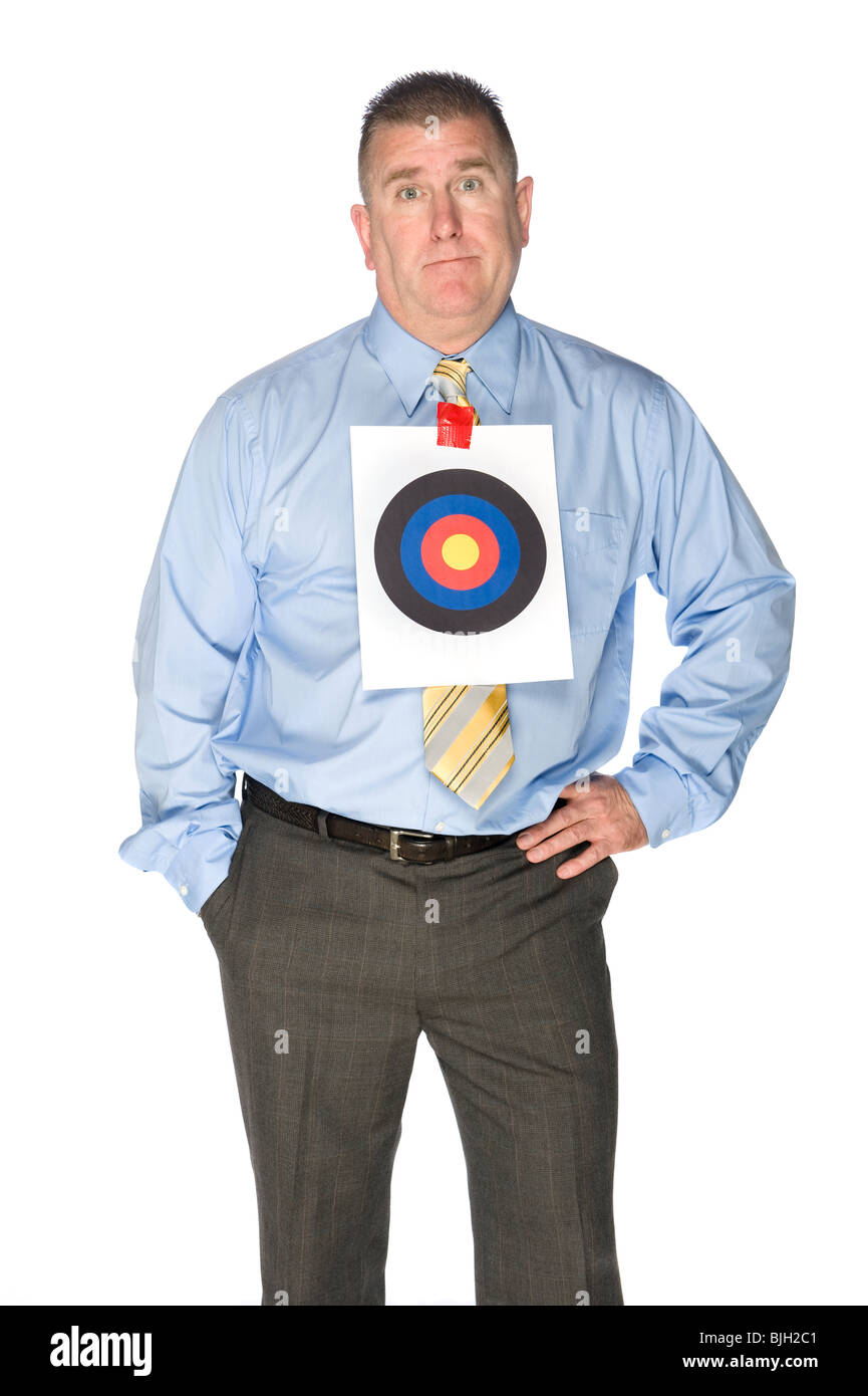 A businessman with a bulls eye target taped to his dress shirt. Stock Photo