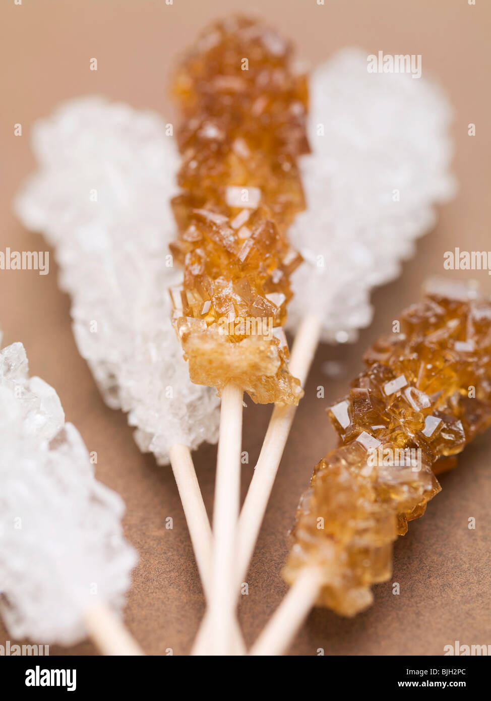 White and brown sugar swizzle sticks Stock Photo Alamy