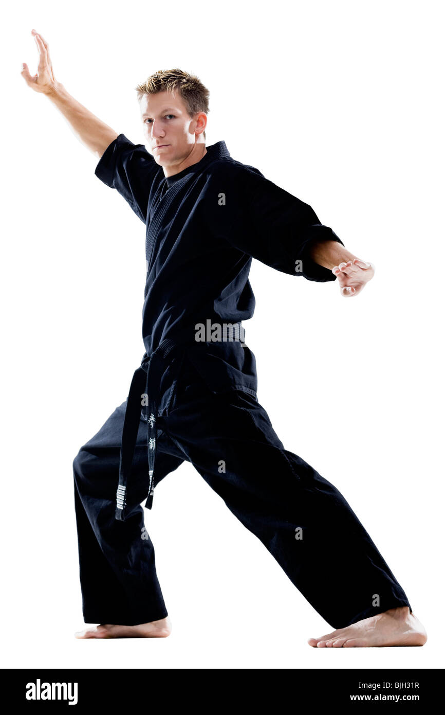 man in a black karate gi practicing martial arts Stock Photo Alamy