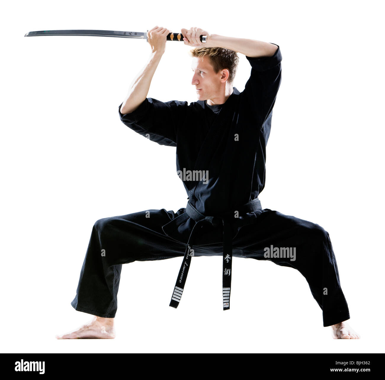 A Man, In A Black Kimono Is Practicing Martial Arts Technique With A Long  Bamboo Fighting Stick. Stock Photo, Picture and Royalty Free Image. Image  91980191.