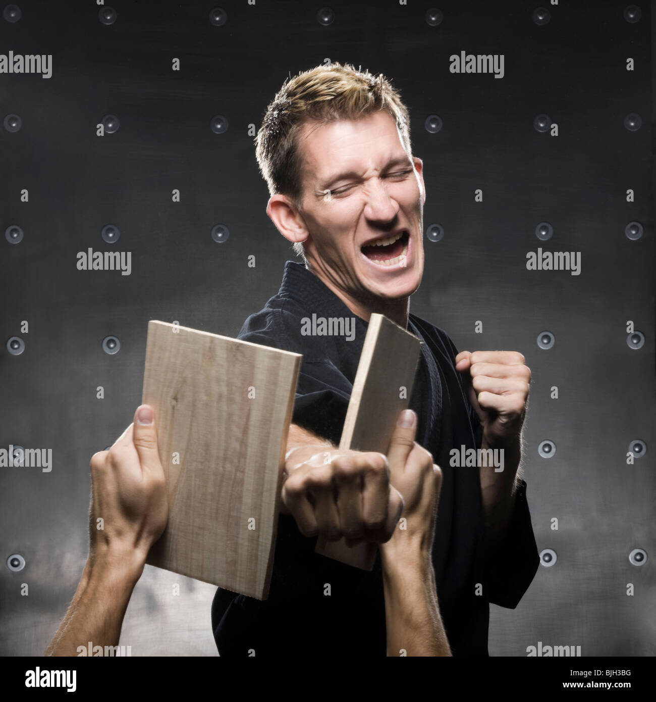 man in a black karate gi practicing martial arts Stock Photo Alamy