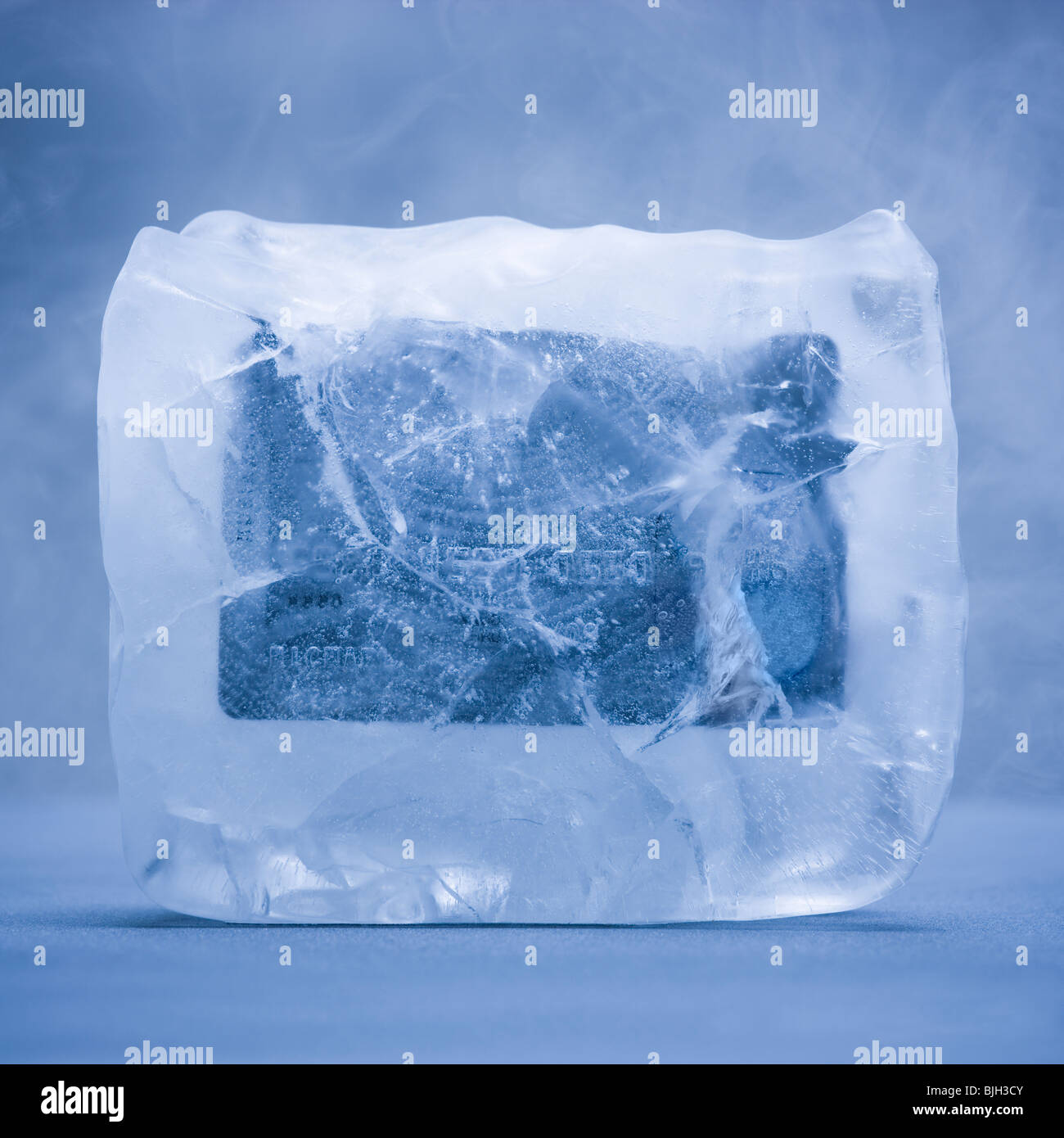 credit card frozen in a solid block of ice Stock Photo Alamy