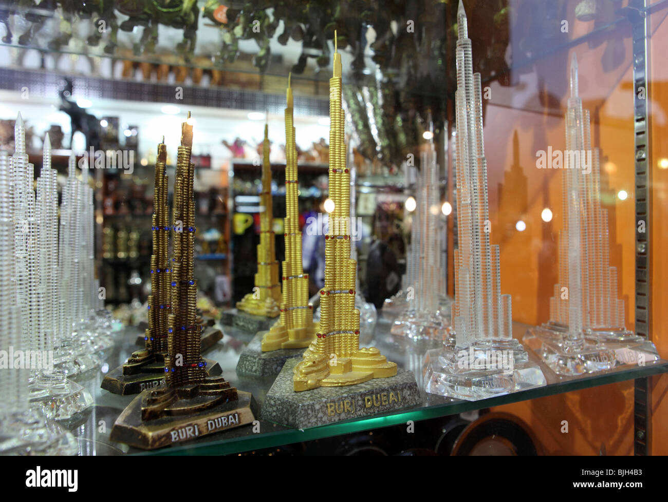 Reproductions of the Burj Dubai in a souvenir shop window, Dubai