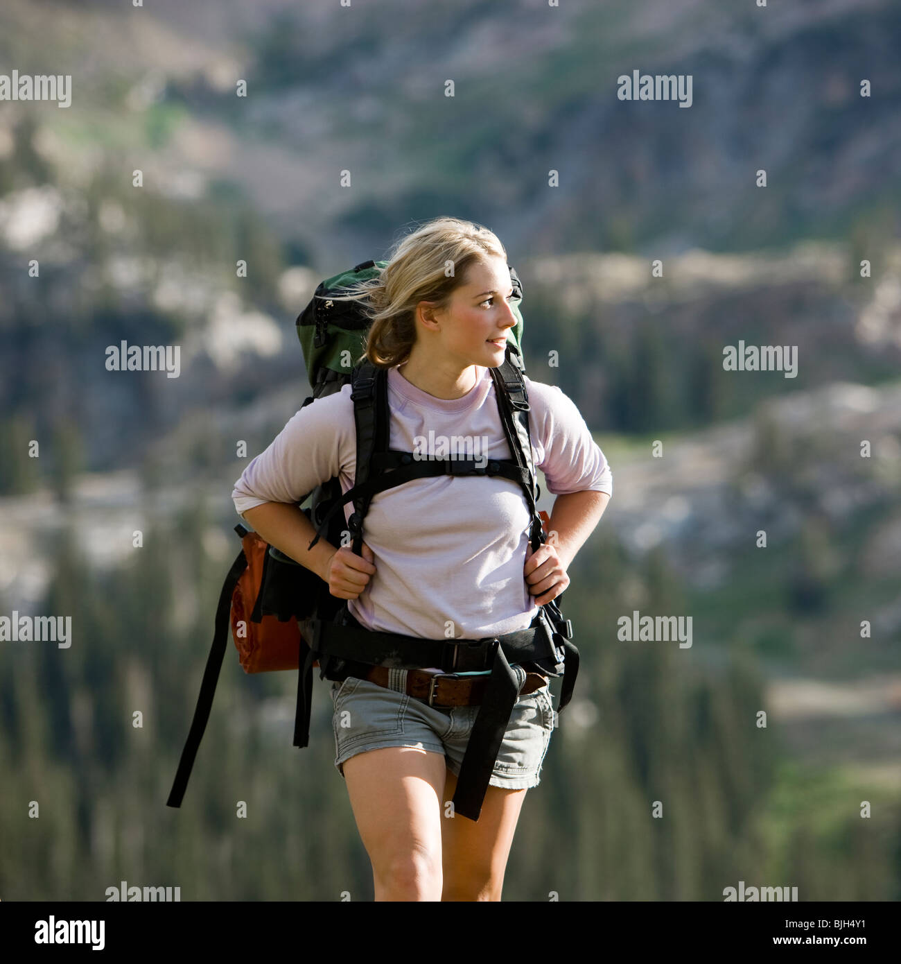 backpackers hiking through the wilderness Stock Photo