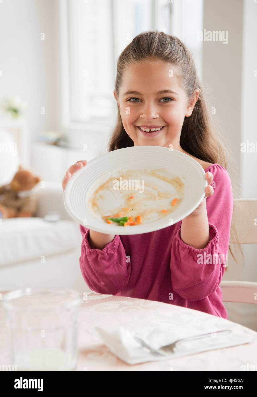 Young girl holding plate Stock Photo