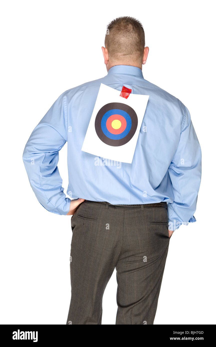 A businessman with a bulls eye that someone taped onto his shirt. Stock Photo