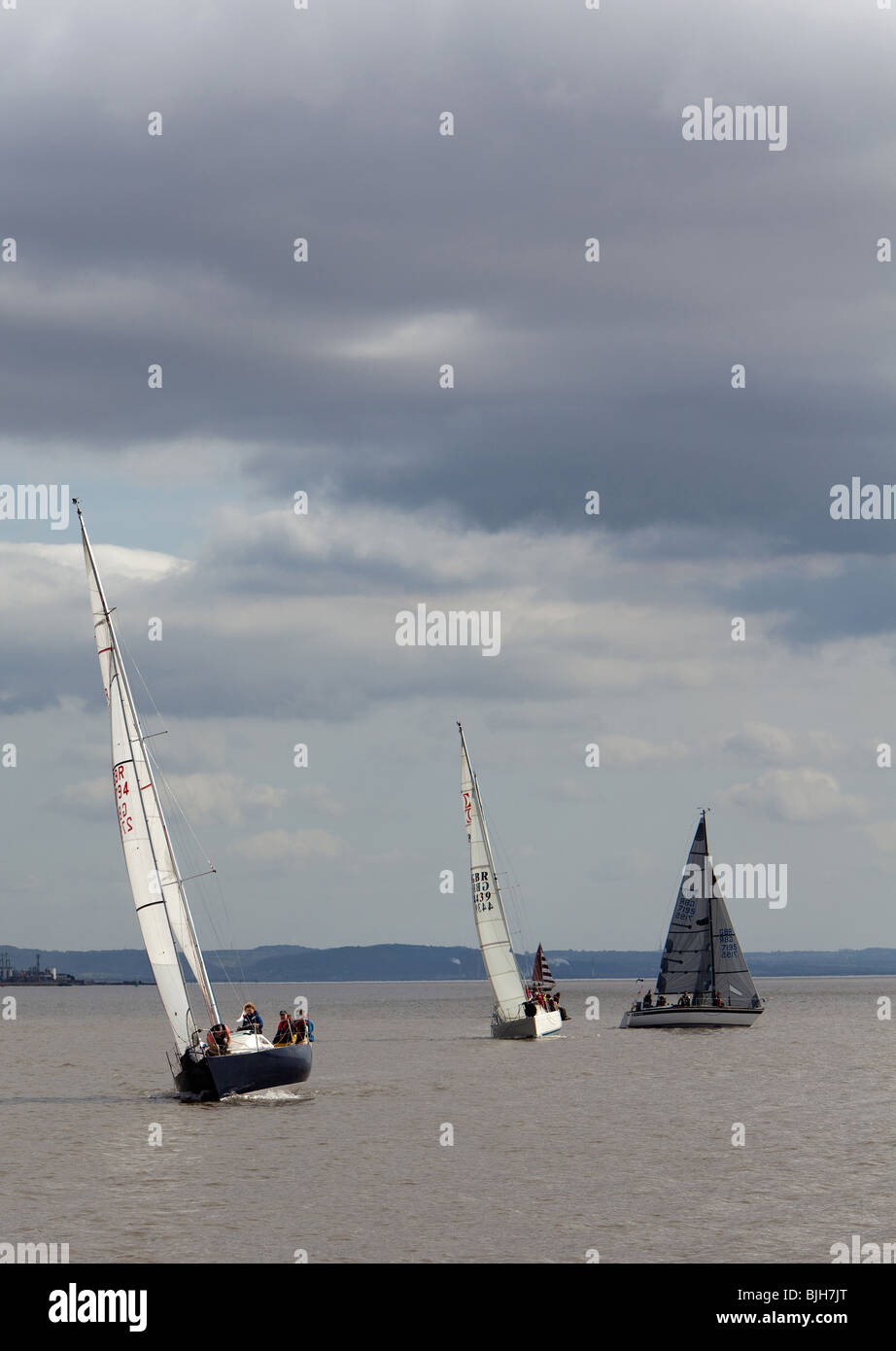 Racing yachts on river Mersey round marker buoy Stock Photo