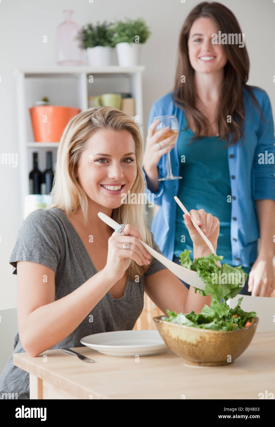 Woman serving salad Stock Photo