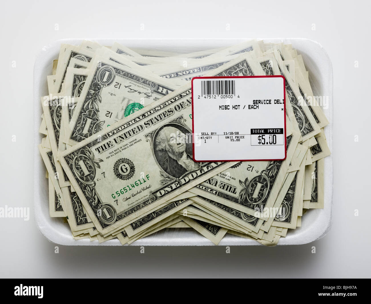 us dollars in a supermarket shrinkwrap package Stock Photo