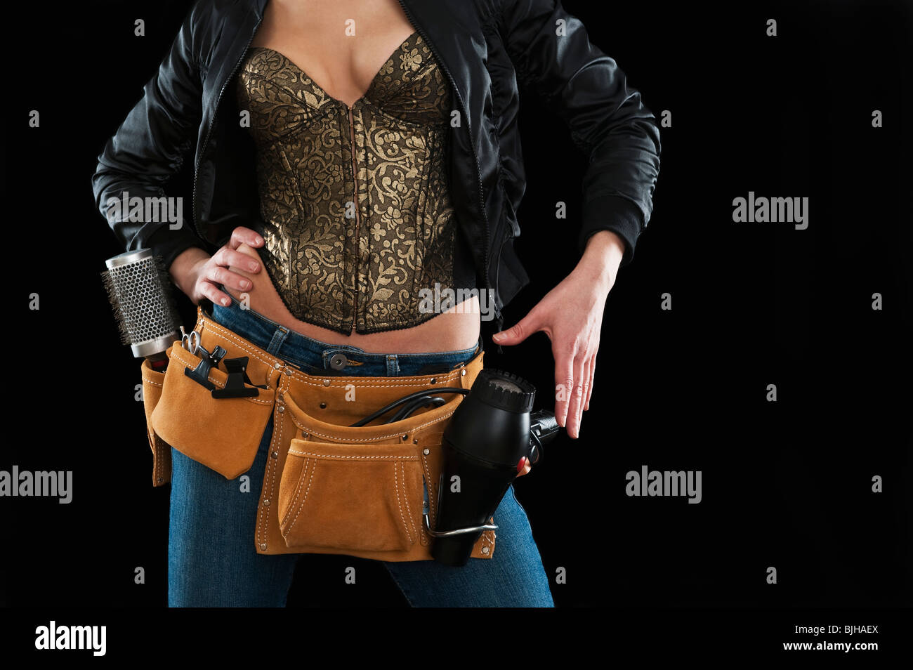 Hair stylist wearing a tool belt Stock Photo