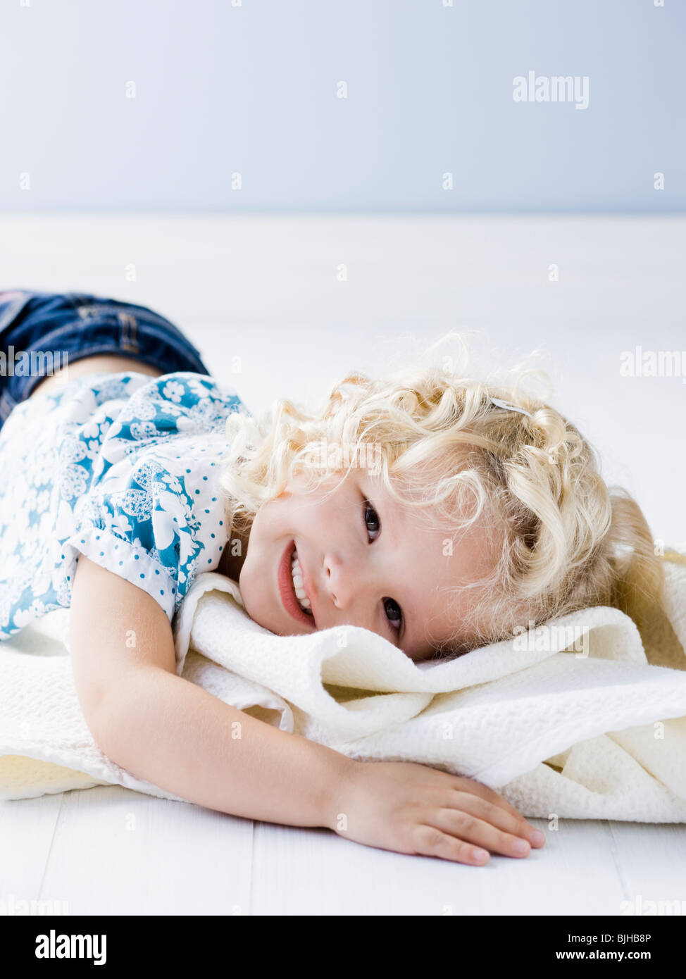little girl holding her blanket Stock Photo Alamy