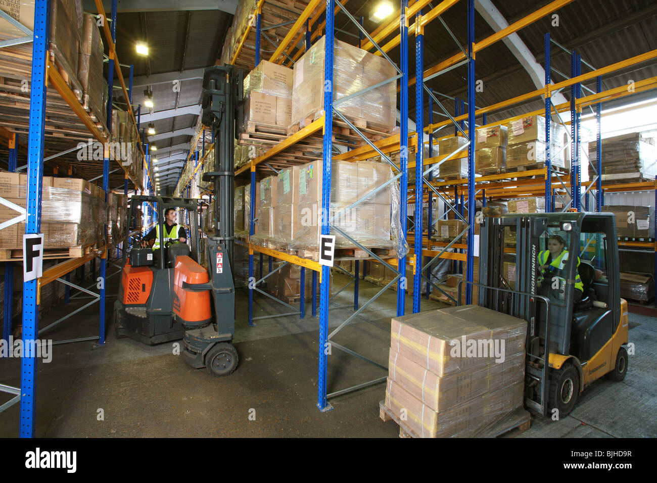 Forklift truck operating in warehouse Stock Photo