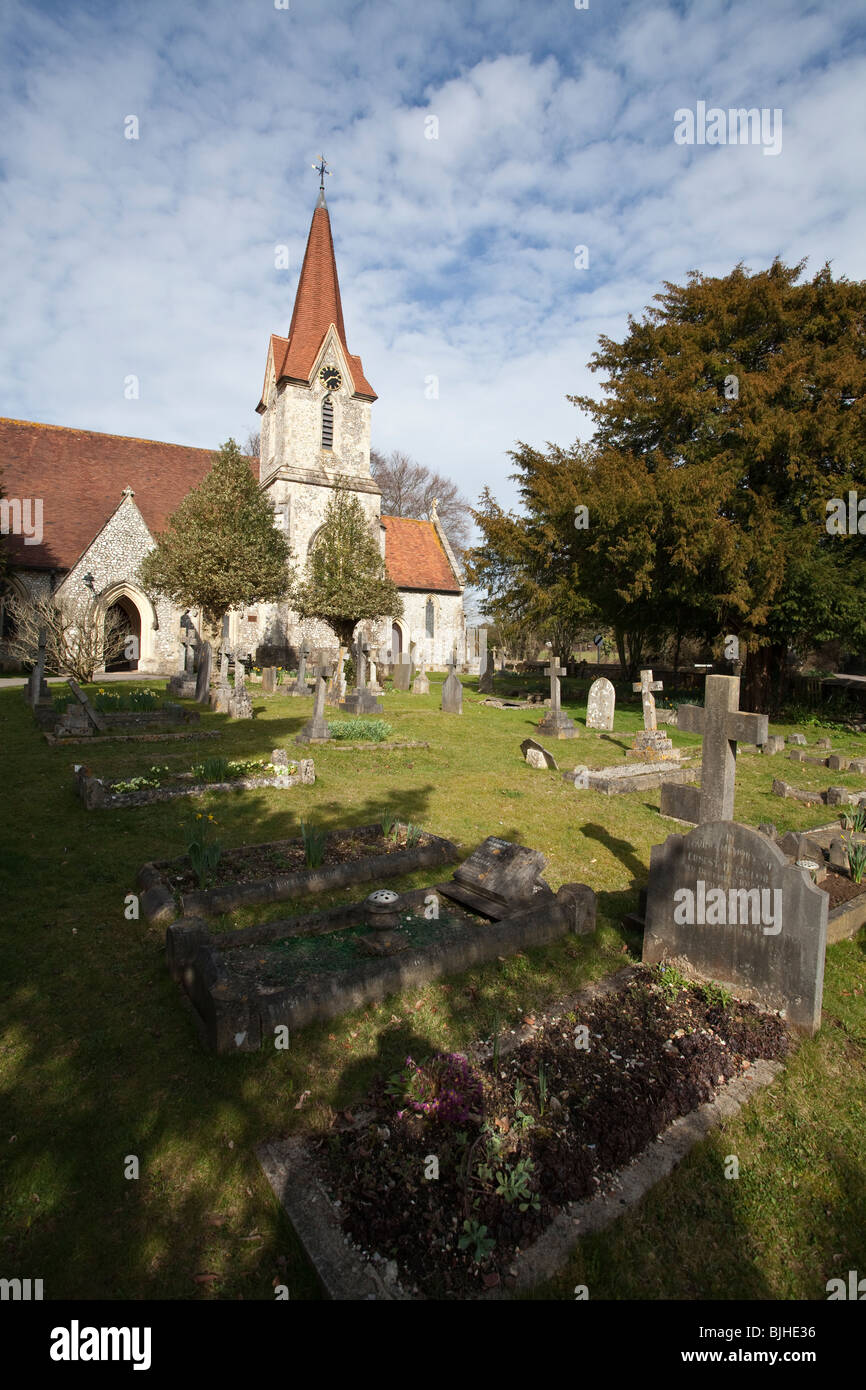 English country village church with spire and church yard. Holy Trinity