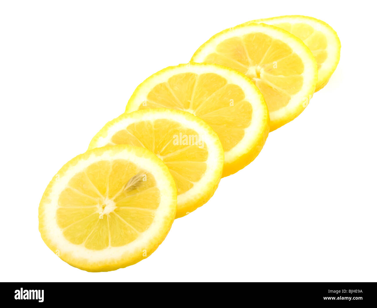 Five slices of lemons on white background Stock Photo