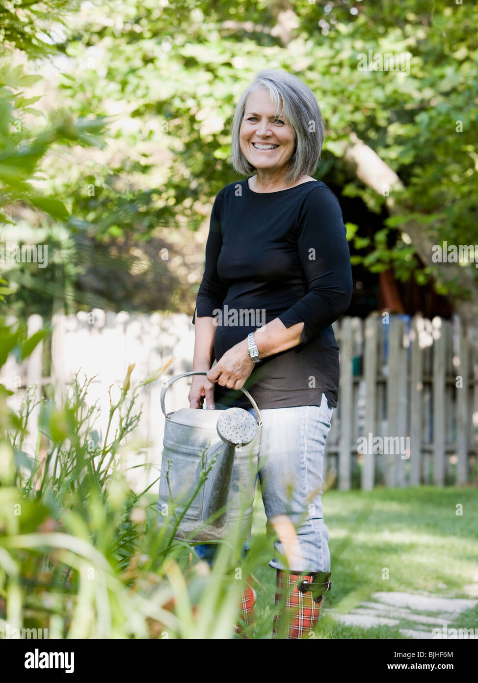senior woman in the garden Stock Photo - Alamy