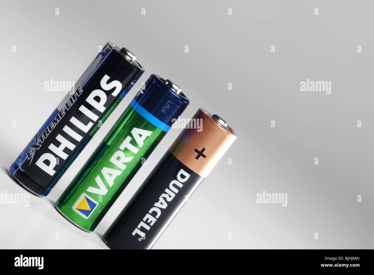 Set of three different AA batteries Stock Photo