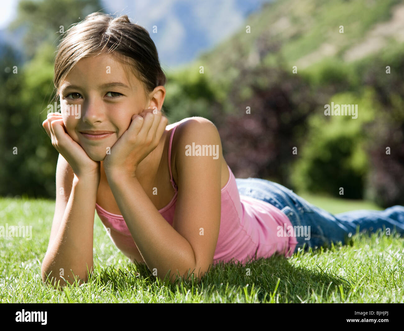 Girl Base Lying In Grass