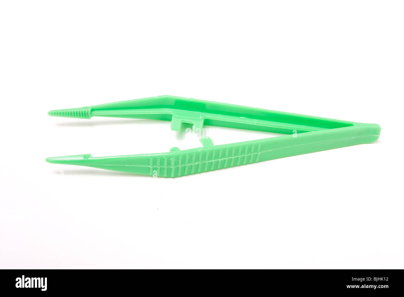 Green plastic sterile Surgical Tweezers isolated against white