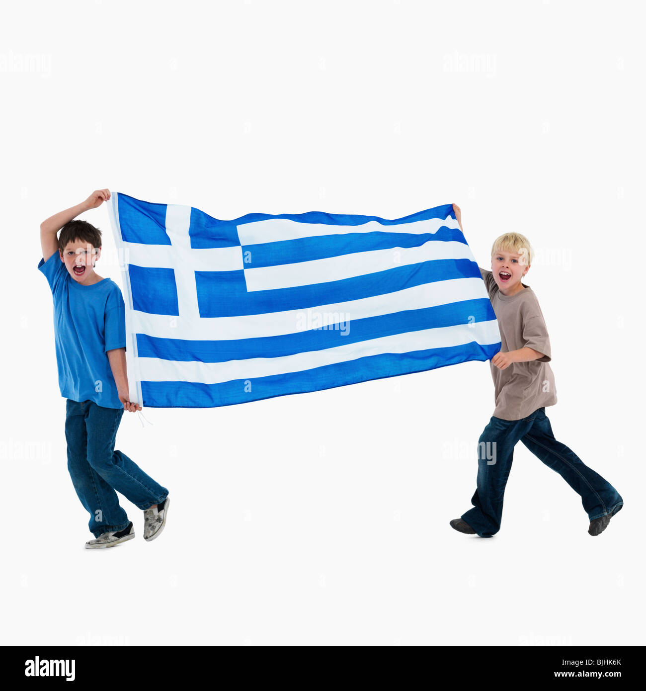 Two boys carrying flag Stock Photo