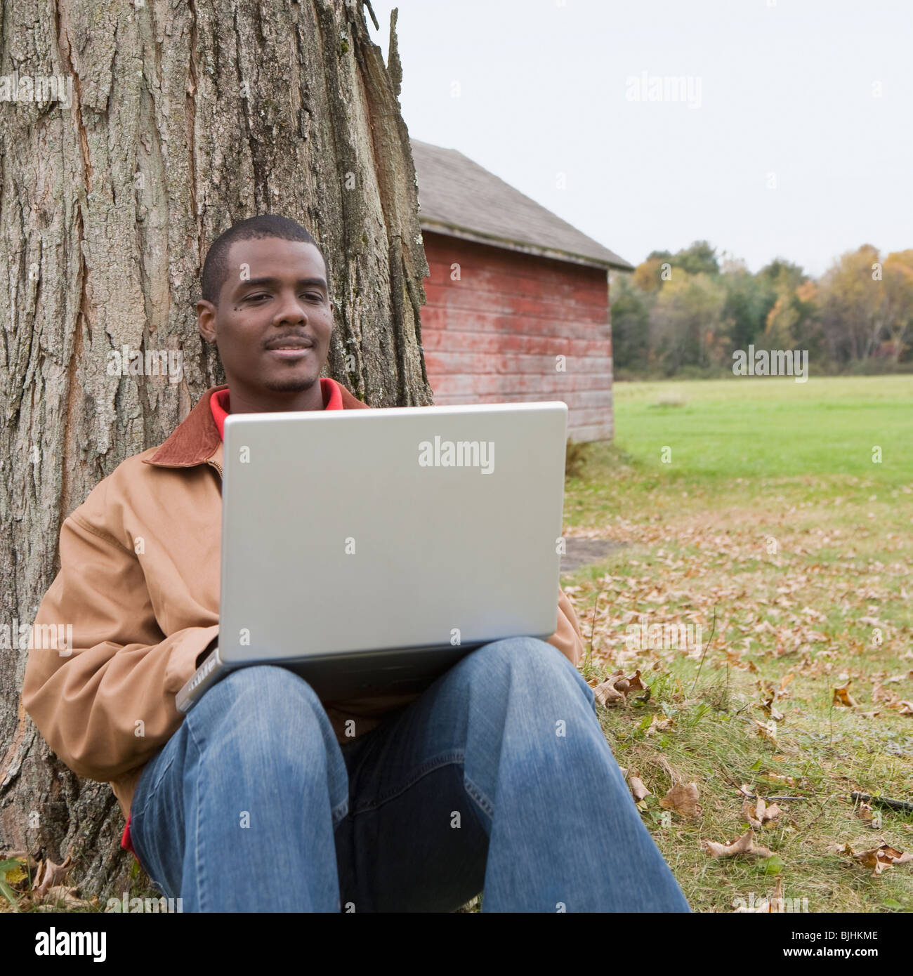 Man using laptop outside Stock Photo