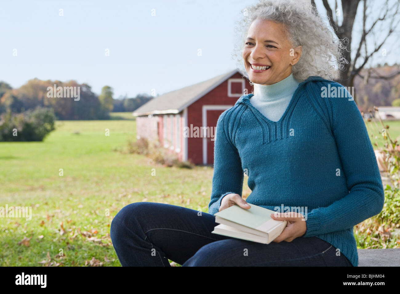 Woman holding a book Stock Photo