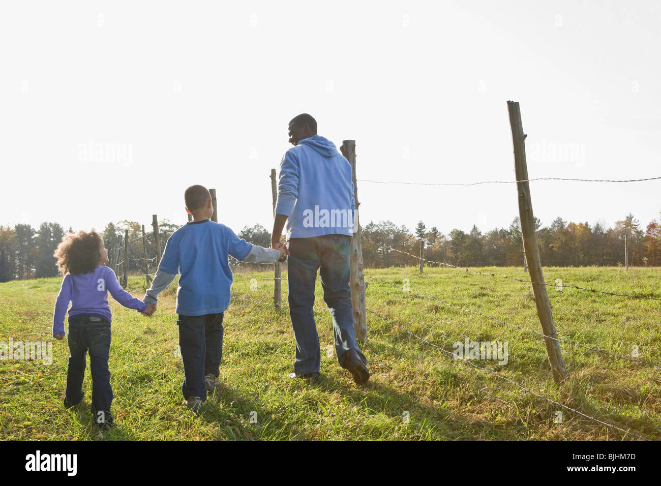 Father and children walking Stock Photo