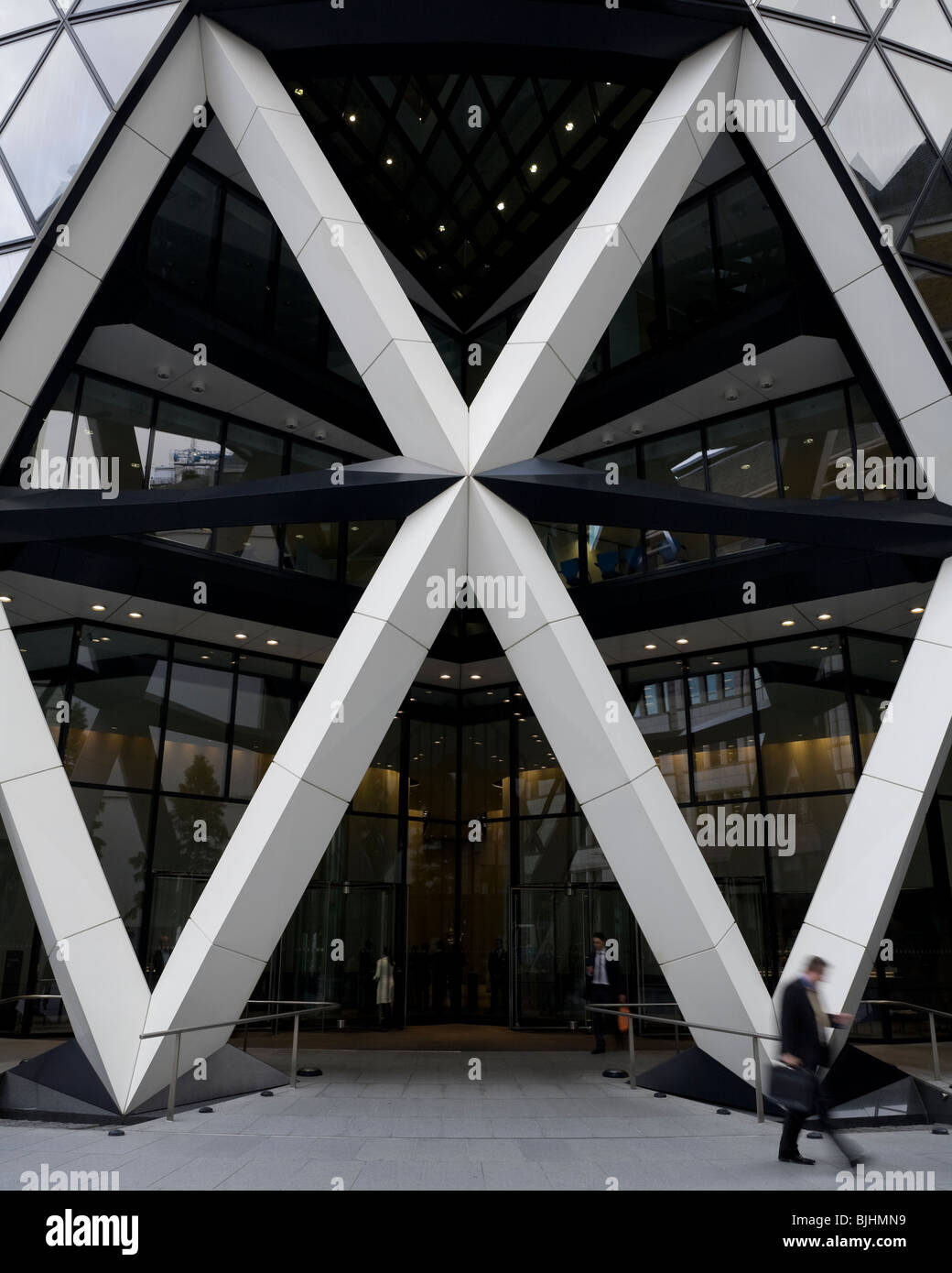 View of the Gherkin's main entrance and piazza at 30 St Mary Axe, showing the strong, white diagrid structured aperture. Stock Photo