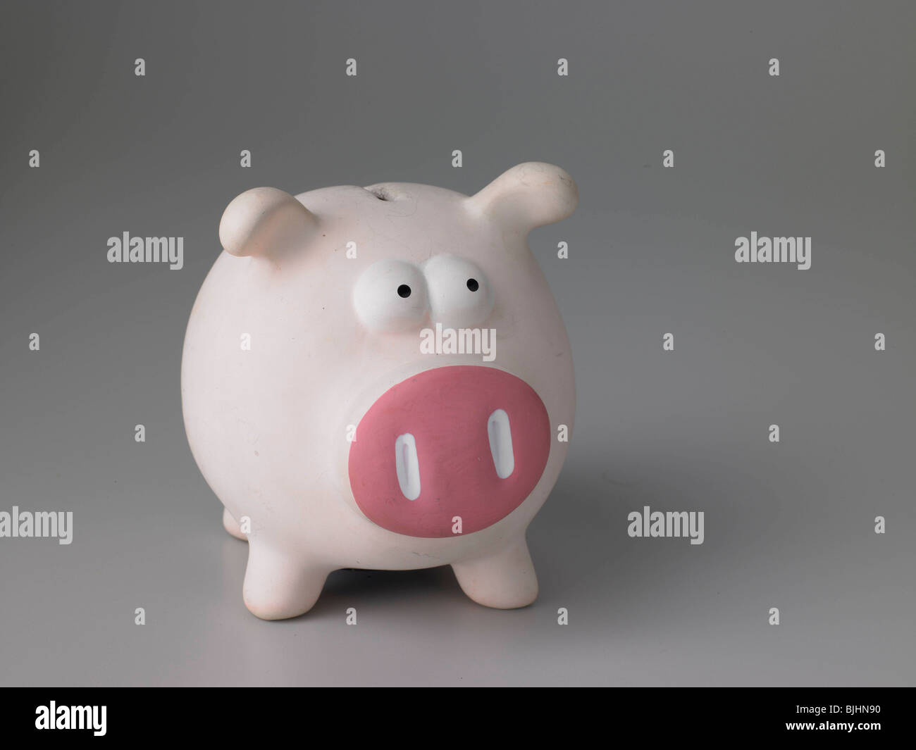 Pink Piggy Bank On Grey Background In Text Friendly Layout Straight On To Pig Stock Photo Alamy