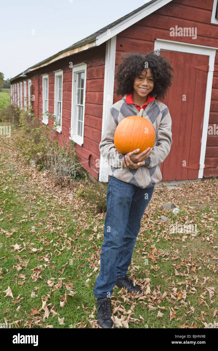 Woman holding a pumpkin Stock Photo