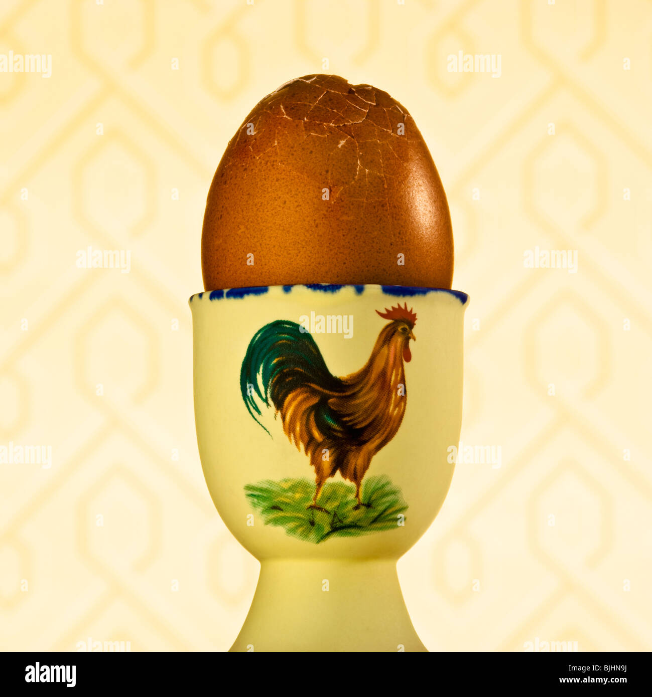 Cracked egg in cup Stock Photo