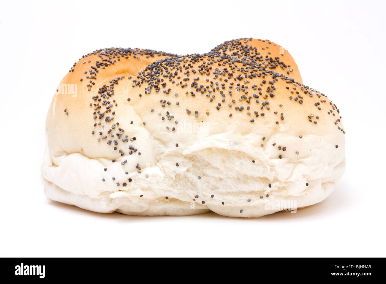 Seeded bread roll from low viewpoint isolated against white background. Stock Photo