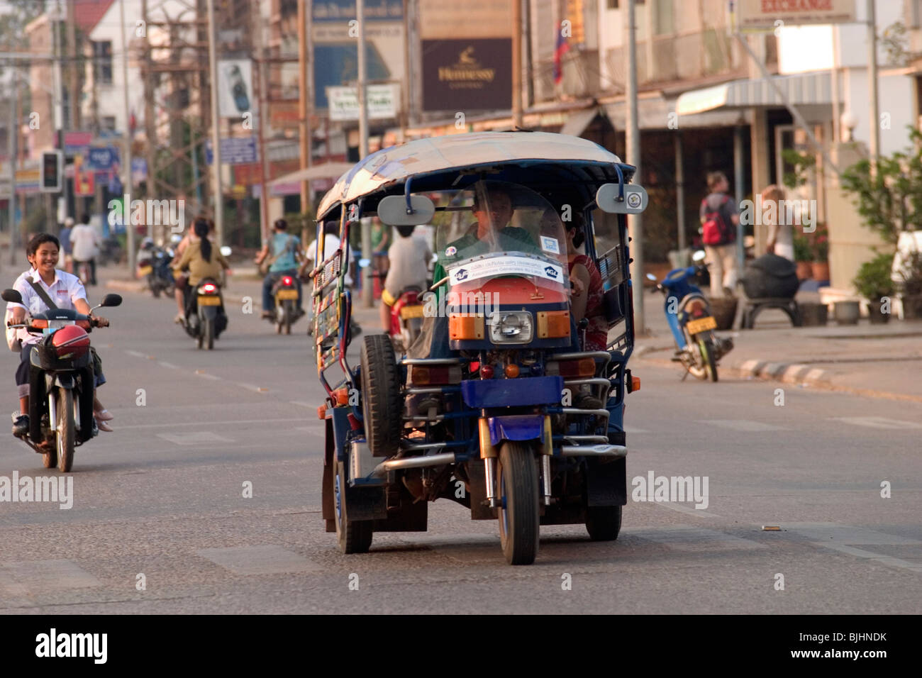 Two-wheel and three-wheel motor traffic in Savannakhet, Lao People's Democratic Republic. Stock Photo