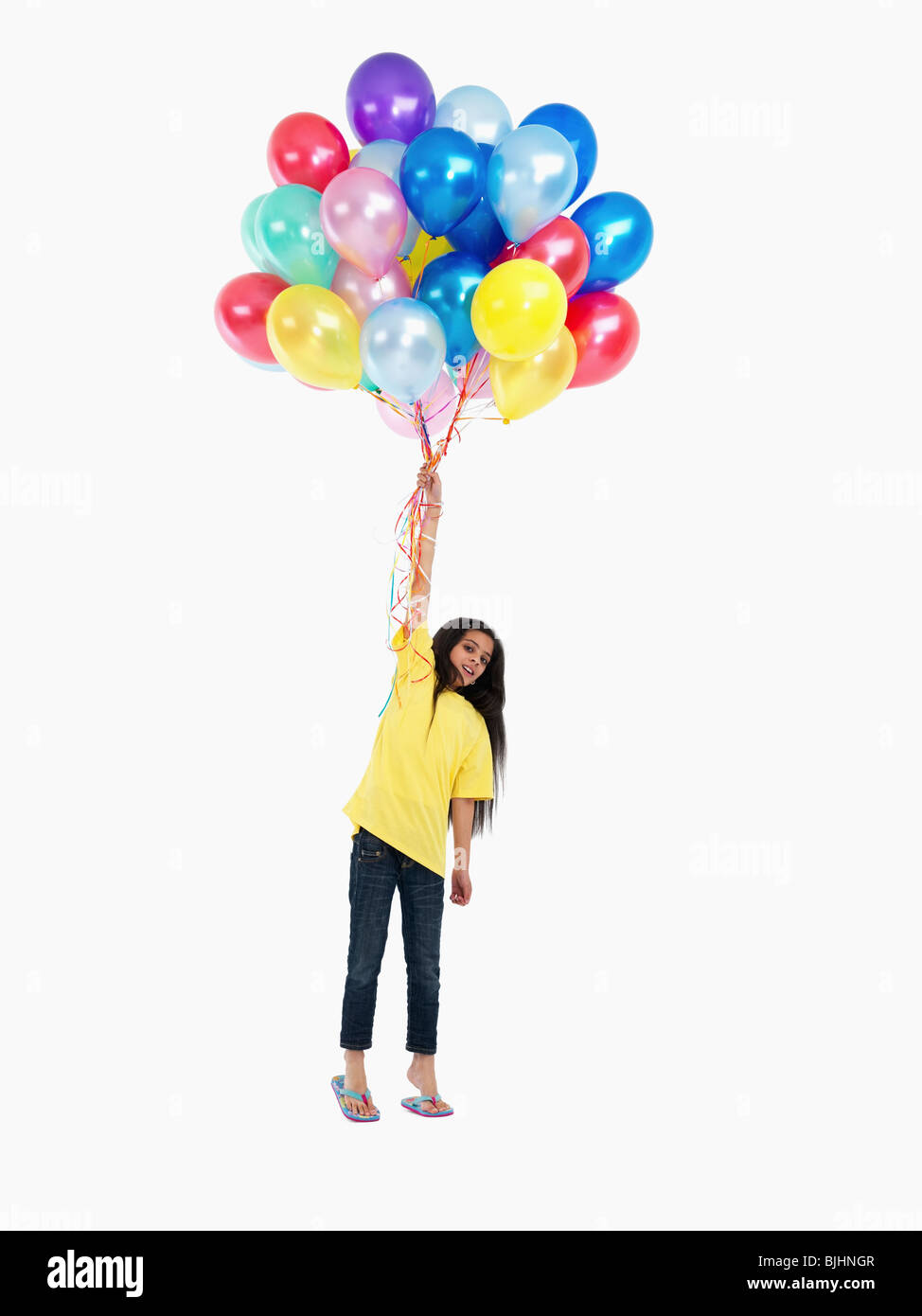 Girl holding balloons Stock Photo Alamy