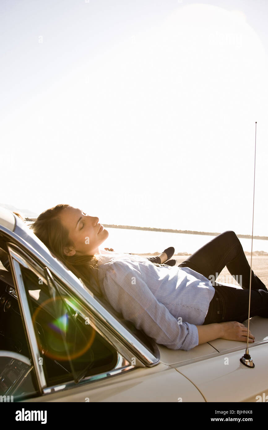 Woman lying on hood car hires stock photography and images Alamy