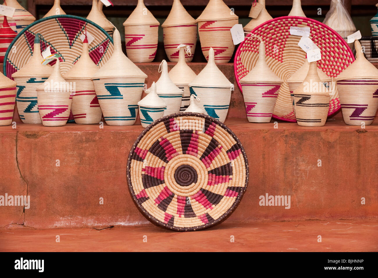 Traditionally weaved baskets on sale for tourists, made by a womans co-op. Rwanda. Stock Photo