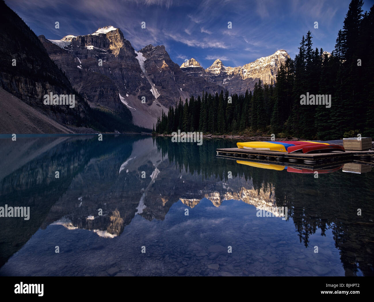 Canada, Alberta, Banff NP. Docked canoes on Moraine Lake, Valley of the Ten Peaks Stock Photo