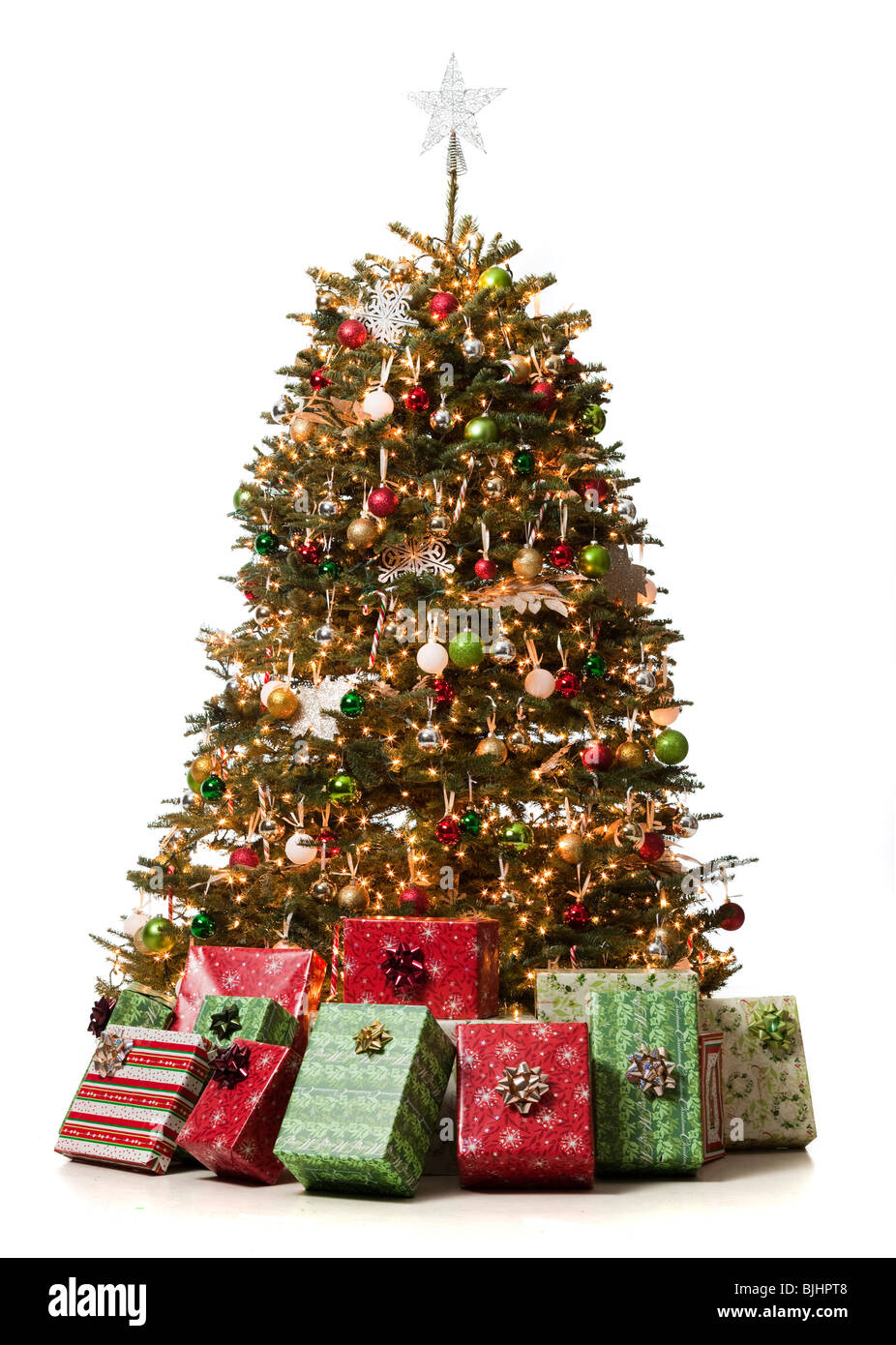 christmas tree with presents underneath it Stock Photo
